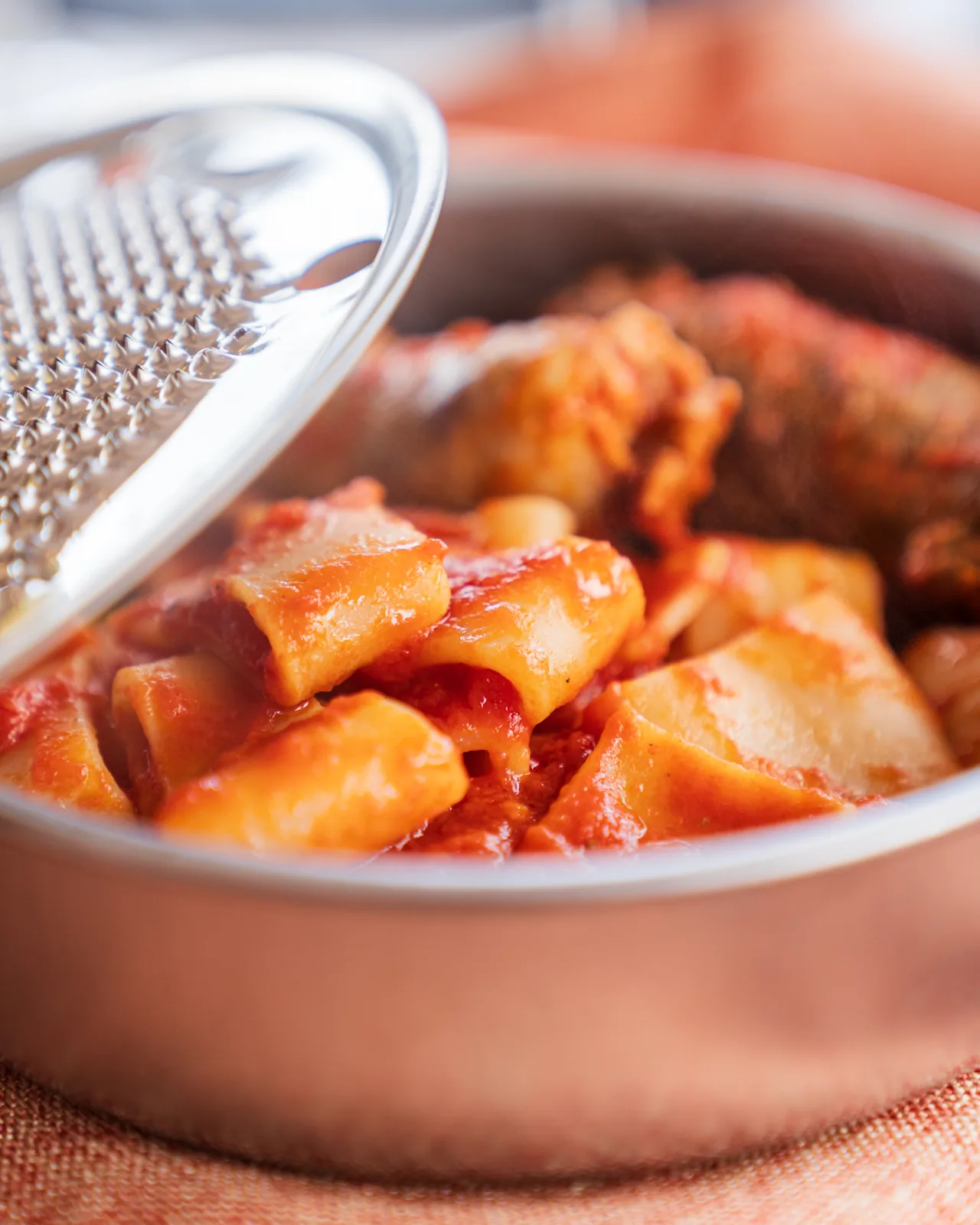 Paccheri with Neapolitan ragù in a copper pot